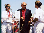 Steve with two members of the USA Gold Medal winning Women's World Cup Soccer Team.